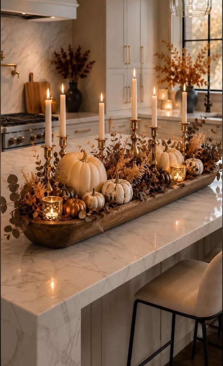 Fall arrangement in a wooden dough bowl with brass candlesticks