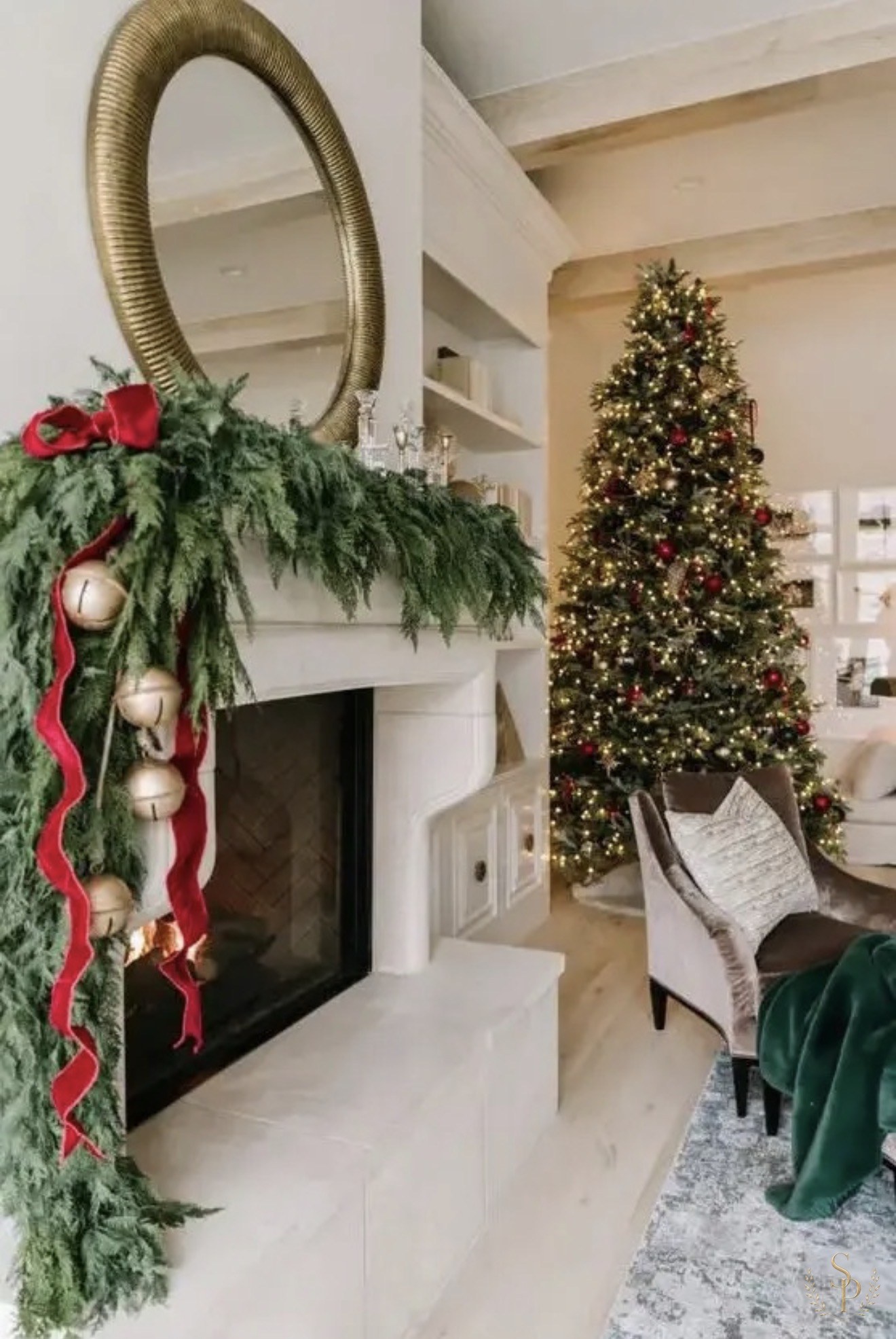 Cedar garland with oversized bells and a softly lit Christmas tree