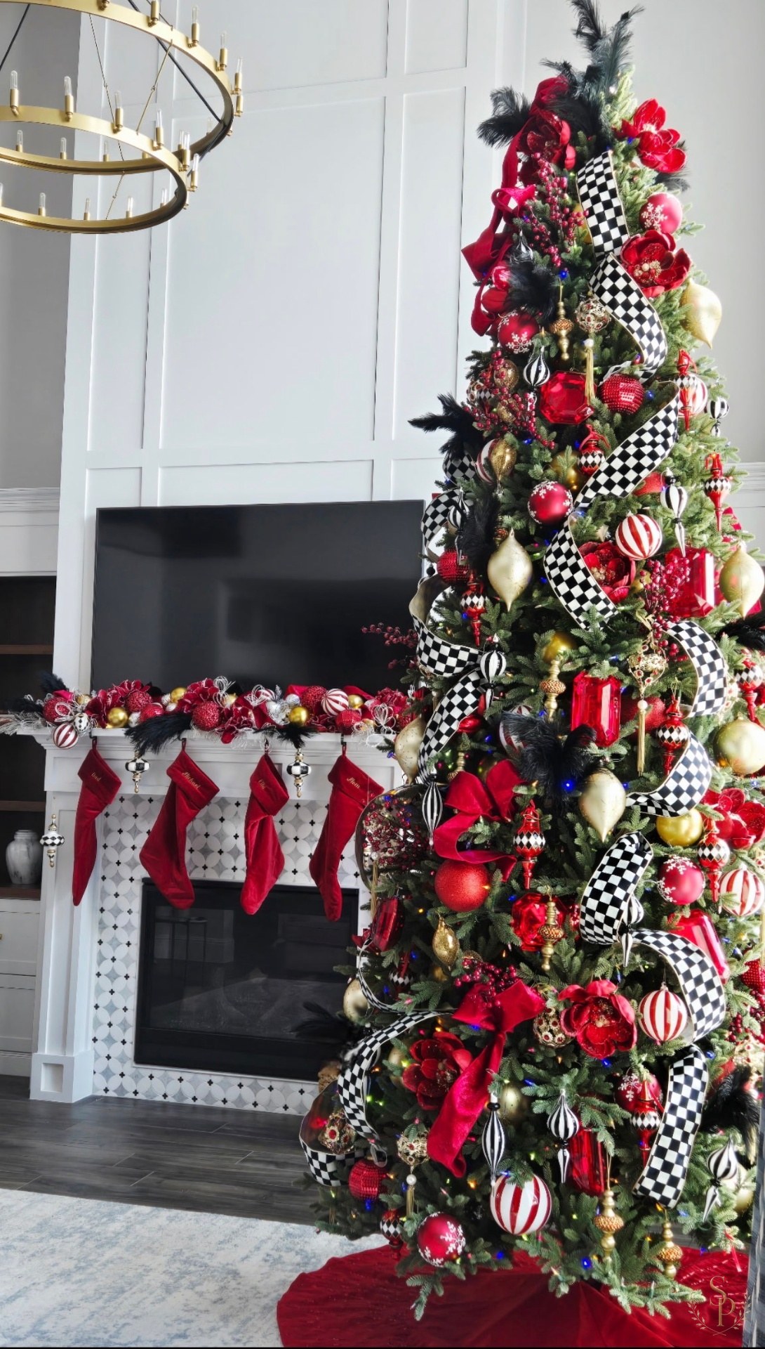 Dramatic red, black, and check-ribbon Christmas tree with coordinating mantel