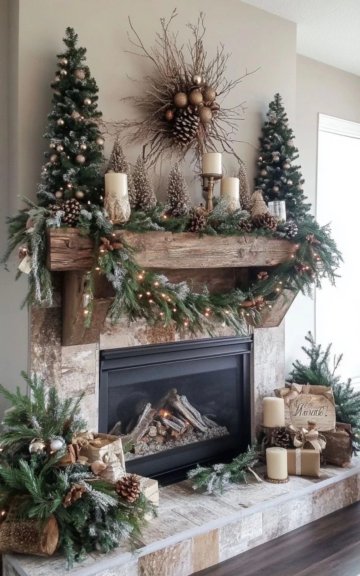 Rustic mantel with flocked garland, bottle-brush trees, and candlelight