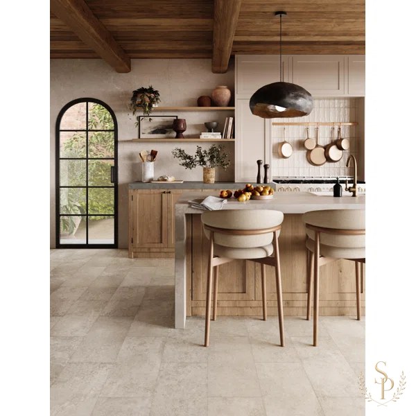 Warm white oak kitchen with honed stone counters and unlacquered brass hardware