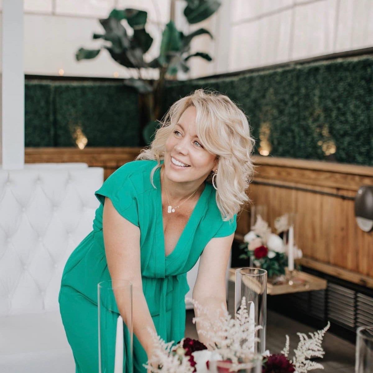 Stacy Parsons styling a table setting with florals and candles