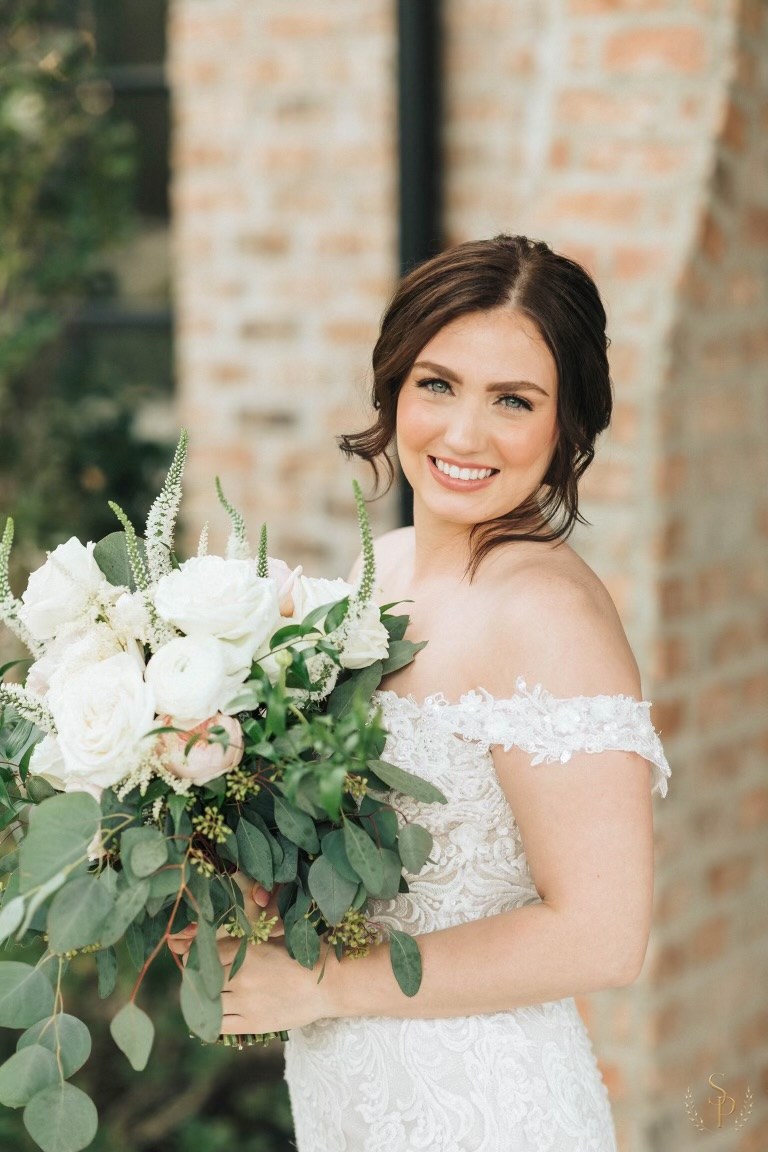 Bride portrait with a soft white and blush bouquet of roses and eucalyptus